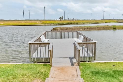 a dock in the middle of a body of water at Beach Club Seas the Day in Padre Island