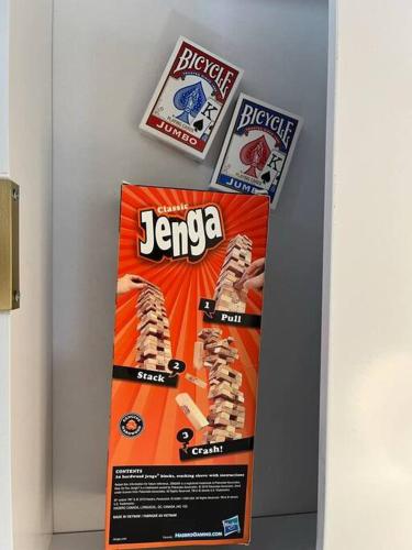an orange sign on a wall with food on it at Family Beach Fun Spot, Firepit, Games, FireTV in Michigan City
