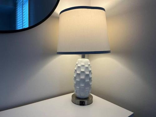 a white lamp sitting on a white table at Family Beach Fun Spot, Firepit, Games, FireTV in Michigan City