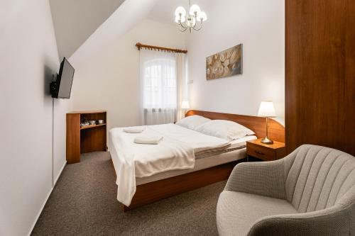 Postel nebo postele na pokoji v ubytování Vila Vyšehrad