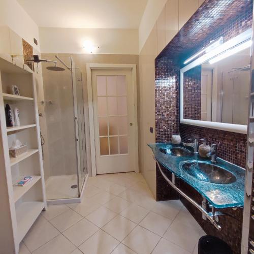 a bathroom with a sink and a shower at il Sole di Baggio in Milan