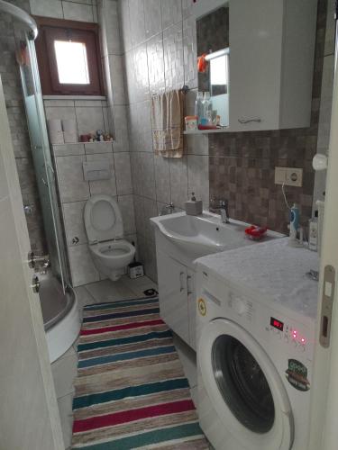 a bathroom with a washing machine and a sink at Private Room in Istanbul #51 in Tuzla