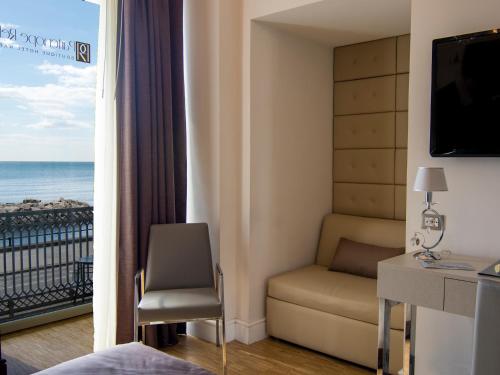 a room with a room with a view of the ocean at Partenope Relais in Naples