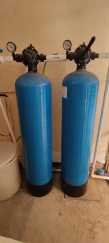 two blue fire hydrants sitting next to a toilet at Shree Swami Samarth Resort in Diveagar