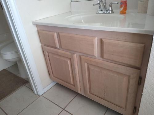 a bathroom with a sink and a toilet at Regatta Bay in Lake Ozark