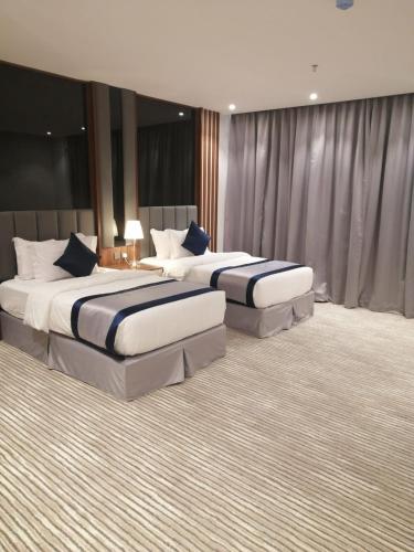 Katil atau katil-katil dalam bilik di Tulip View Hotel