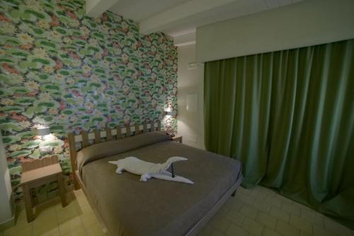 Lova arba lovos apgyvendinimo įstaigoje Villa Adua