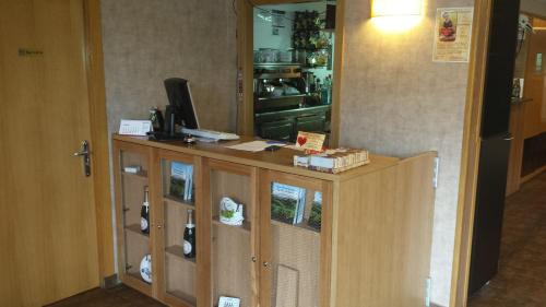 a wooden cabinet with a television on top of it at Guilleumes Montserrat in Monistrol