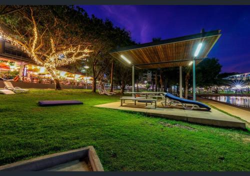 a park with a bench and a playground at night at One-bed apartment at Darwin Waterfront Precinct in Darwin