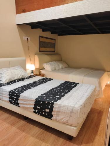 Postel nebo postele na pokoji v ubytování Chalet Kampung Yan (OFFICIAL)