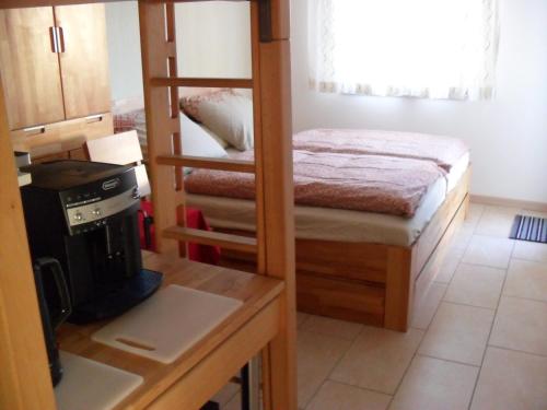 a bedroom with a bunk bed and a stove at Apartment Suda in Rheinhausen