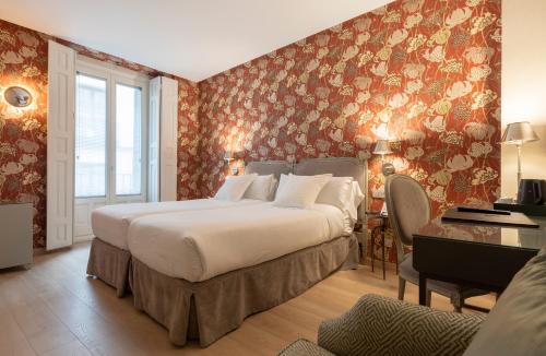 Ένα ή περισσότερα κρεβάτια σε δωμάτιο στο Hotel Meninas - Boutique Opera