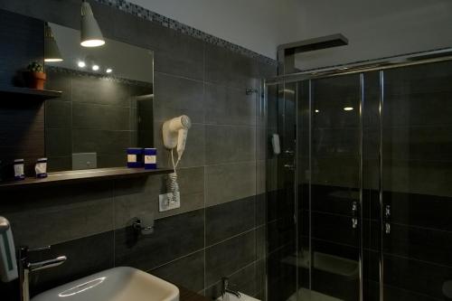 a bathroom with a shower and a sink at TUISuneo La Conchiglia - Adults Only in Capo Vaticano