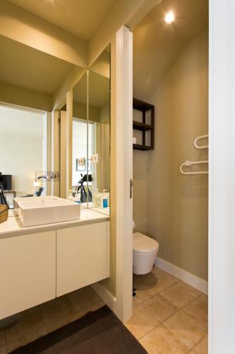 a bathroom with a sink and a toilet at RVA - Porto Central Flats in Porto
