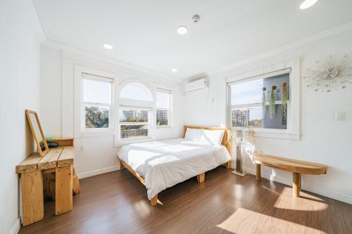 En eller flere senge i et værelse på Gallery Sohee's House