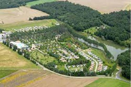 an aerial view of a park with houses and a river at SAS MHVACANCES LOUE MOBILHOME 2 CHAMBRES PROCHE CHATEAUX et ZOO BEAUVAL in Onzain