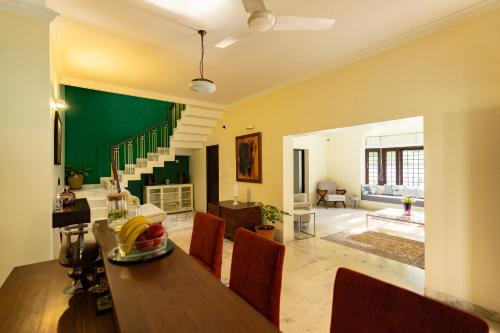 a kitchen and dining room with a table and chairs at Luho 187 in Bengaluru