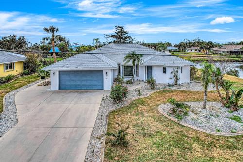 a house with a garage and a driveway at Rotonda Getaway in Rotonda West