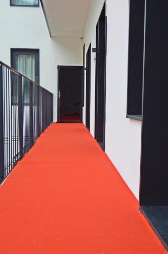 a red carpeted corridor with doors in a building at Lisbon City Hollywood Hotel by City Hotels in Lisbon