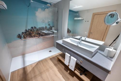 a bathroom with a sink and a mirror at Bahia Principe Grand Bavaro - All Inclusive in Punta Cana