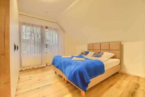 Postel nebo postele na pokoji v ubytování Apartamenty Bianka