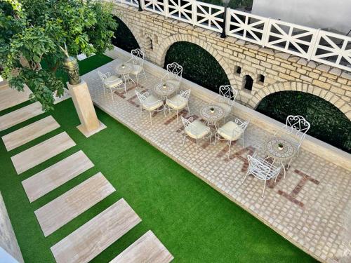 an overhead view of a table and chairs and a bridge at Hotel Vila Mimani in Berat