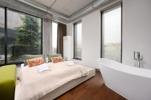 Posteľ alebo postele v izbe v ubytovaní Rich Sopot by OneApartments