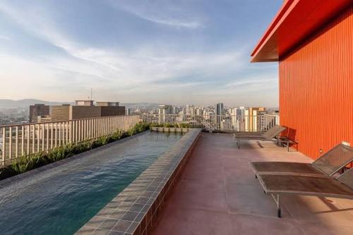 a swimming pool on the roof of a building at Studio Allianz Perdizes in Sao Paulo