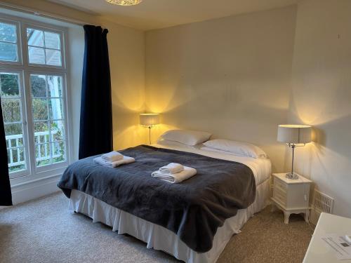 מיטה או מיטות בחדר ב-Croydon House