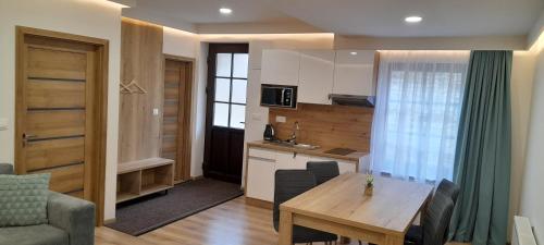 Kuchyň nebo kuchyňský kout v ubytování Apartmány Lumi