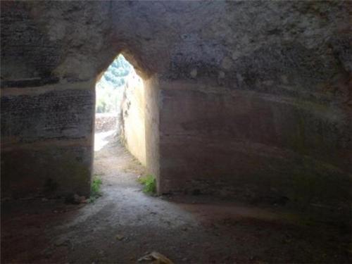 a tunnel in an old building with an archway at Kastorio-Villy's Guest House in Kastórion