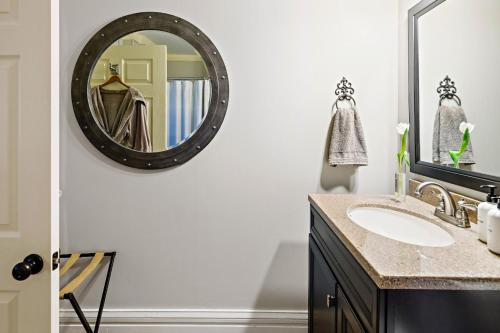 a bathroom with a sink and a mirror at The Watson Boutique Bed and Breakfast in Thompson