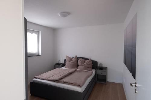 a bedroom with a bed and a window at Top Wohnung mit traumhaftem Fernblick in 1A-Lage! in Hagen