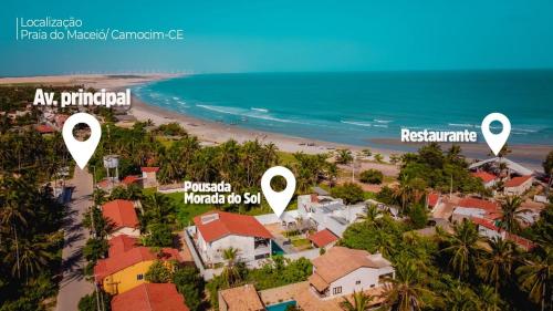an aerial view of a beach with houses and the ocean at Pousada Morada do Sol in Camocim