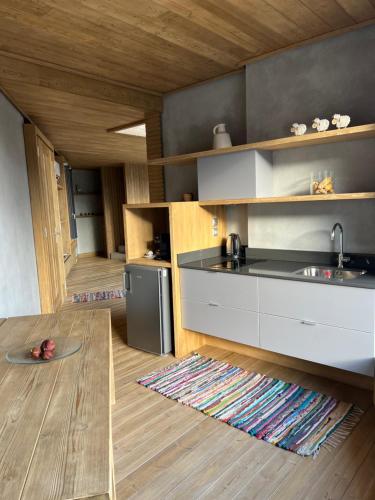 a kitchen with a sink and a counter top at Escapade Luxury Residences in Karpenision