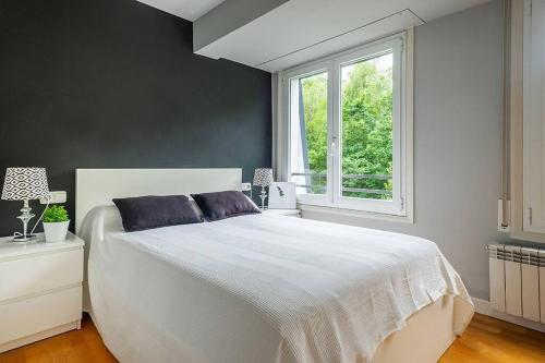 Posteľ alebo postele v izbe v ubytovaní Apartamento a 5min de la playa de Ondarreta