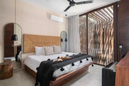 En eller flere senge i et værelse på Apartamento Vacacional Tulum Quintana Roo Mexico