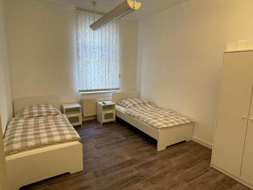 Кровать или кровати в номере Zentrale und großzügige Monteurswohnung