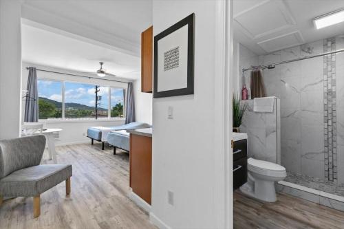 a room with a bathroom with a toilet and a sink at Unit 17 Maui Ohana Modern Studio in Wailuku