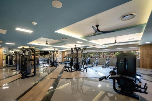 a gym with treadmills and elliptical machines at Riu Santa Fe - All Inclusive in Cabo San Lucas