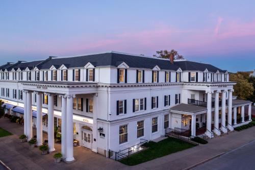 an aerial view of a white mansion with columns at Historic Boone Tavern in Berea