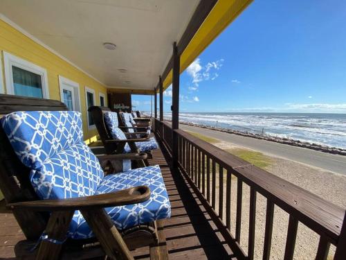 a porch with rocking chairs on the beach at Beach House with Ocean view in Surfside Beach