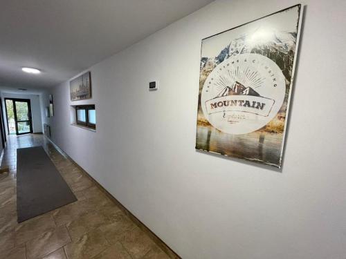 a hallway with a large picture on the wall at Pensiune CasaMircea in Bistriţa