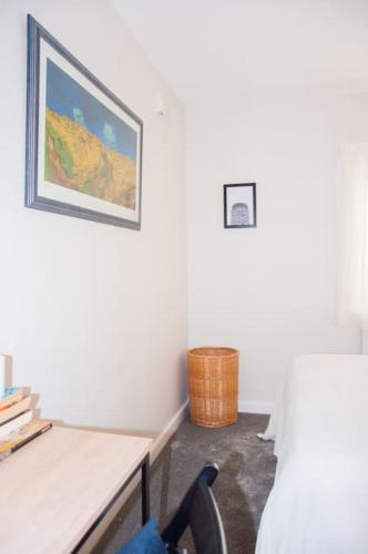 a room with a desk and a chair and a picture at 2 bed 2 bath Apartment with Canal View in Dublin