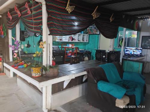 a living room with a couch and a table at Farm Lodge La Cabaña 