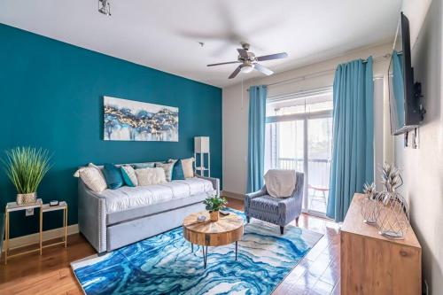 a living room with a couch and a table at Call it Comfy in Houston