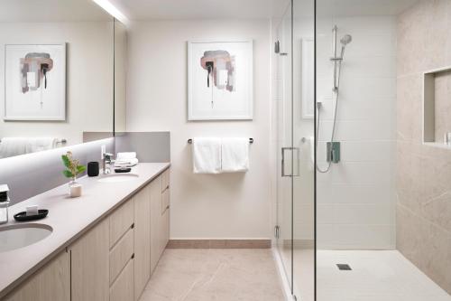 a bathroom with a shower and a sink at Level Seattle Downtown - South Lake Union in Seattle