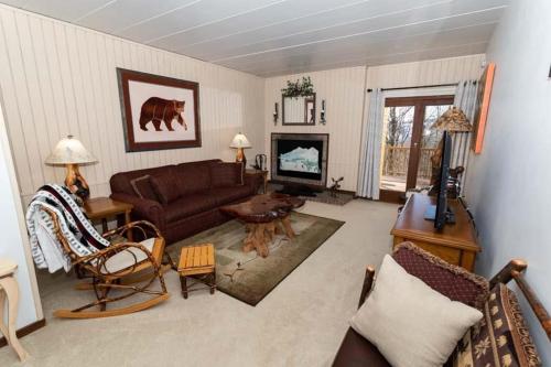 a living room with a couch and a table at Cozy Seven Springs 1 Bedroom Condo with Private Deck condo in Champion