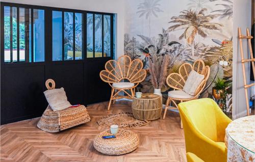 a room with chairs and tables and a door at Lovely Apartment In Stezyca With Sauna in Stężyca
