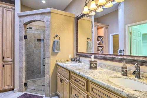 a bathroom with a shower and a sink and a mirror at Lake Havasu City Vacation Rental with Pool! in Lake Havasu City